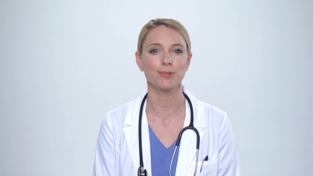 Video Reference N2: Smile, Human body, Neck, Jaw, Sleeve, Medical equipment, Gesture, Stethoscope, Health care, Physician