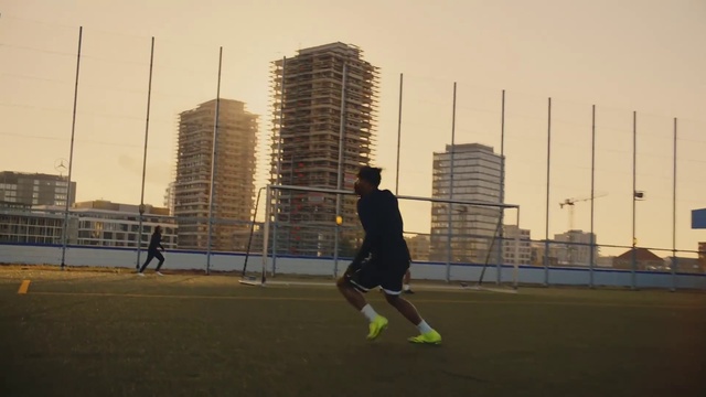 Video Reference N7: Building, Sky, Skyscraper, Sports equipment, Plant, Ball, Tower block, Shorts, Football, City