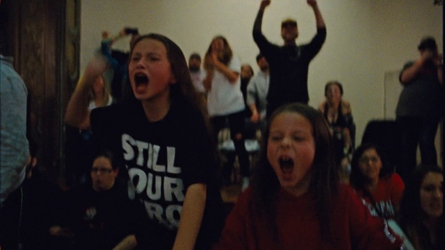 Video Reference N2: Shirt, Facial expression, Human, Fashion, Lighting, Gesture, T-shirt, Crowd, Fun, Community
