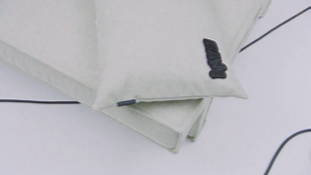 Video Reference N9: Sleeve, Rectangle, Collar, Font, Linens, Pattern, Fashion accessory, Paper product, Paper, Transparency