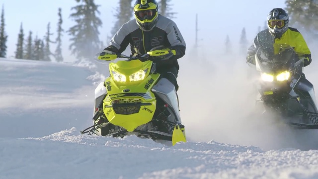 Video Reference N4: Snowmobile, Helmet, Snow, Automotive tire, Slope, Headgear, Racing, Window, Motorsport, Vehicle