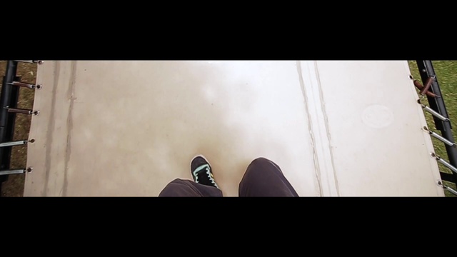 Video Reference N3: Wood, Walking shoe, Font, Floor, Flooring, Rectangle, Tints and shades, Human leg, Darkness, Symmetry