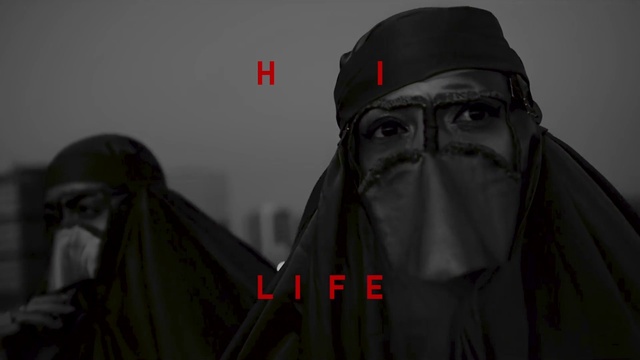 Video Reference N1: Outerwear, Grey, Sleeve, Cap, Personal protective equipment, Fictional character, Facial hair, Carmine, Eyewear, Hoodie