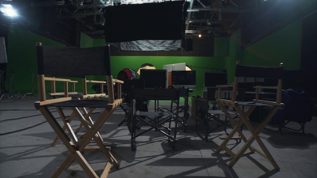 Video Reference N2: Chair, Shade, Entertainment, Event, Leisure, Music venue, Room, Flooring, Folding chair, Darkness