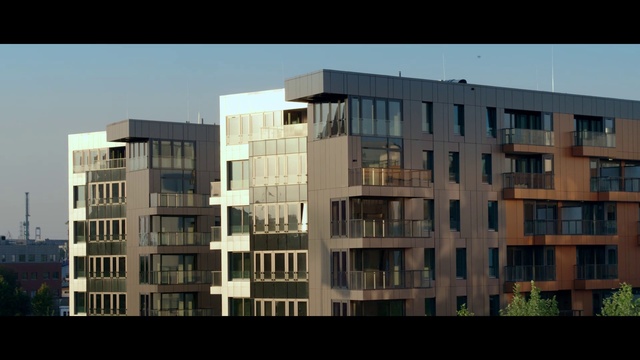 Video Reference N0: Building, Sky, Window, Rectangle, Tower block, Urban design, Condominium, Cloud, Symmetry, Commercial building