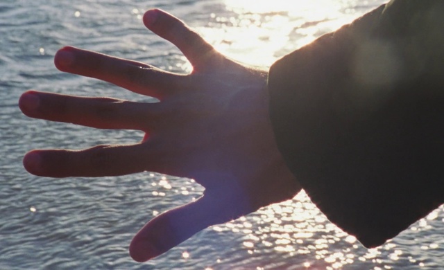 Video Reference N0: Water, Sky, Light, People in nature, Gesture, Sunlight, Finger, Body of water, Thumb, Nail