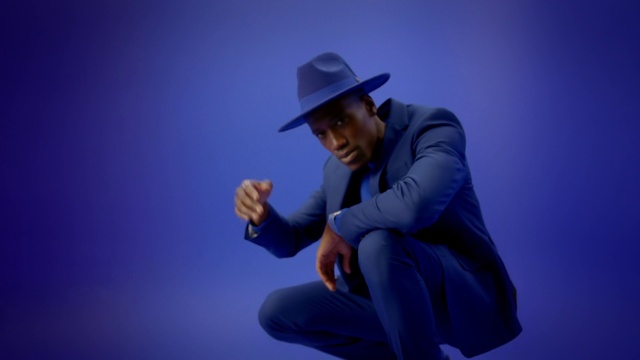 Video Reference N1: Clothing, Hat, Blue, Human body, Flash photography, Sun hat, Fedora, Purple, Sleeve, Gesture