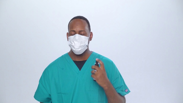 Video Reference N4: Sleeve, Gesture, Medical, Scrubs, Health care provider, Hearing, Service, T-shirt, Electric blue, Workwear
