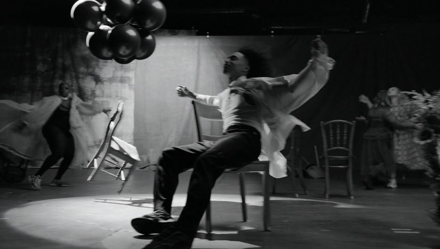 Video Reference N7: Leg, Black, Flash photography, Entertainment, Performing arts, Black-and-white, Balloon, Style, Chair, Knee
