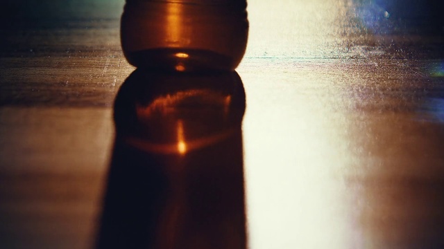 Video Reference N0: Brown, Drinkware, Liquid, Bottle, Light, Glass bottle, Amber, Fluid, Bottle stopper & saver, Wood