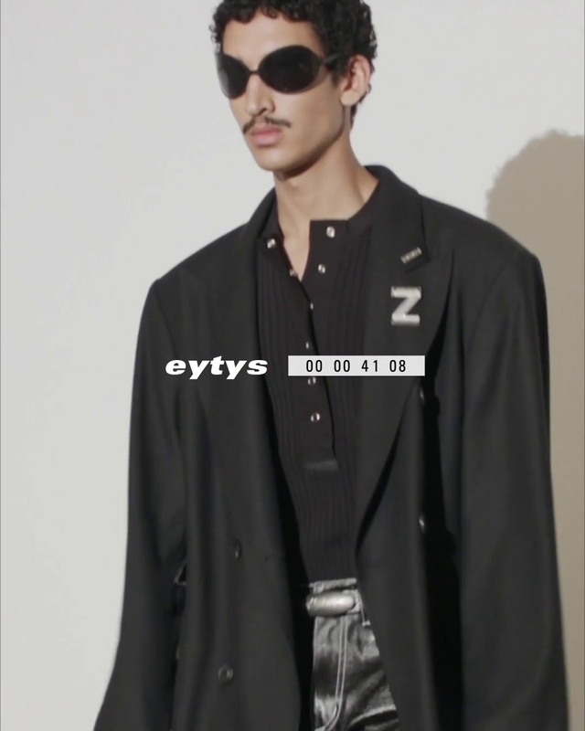 Video Reference N12: Face, Outerwear, Shoulder, Vision care, Jersey, Street fashion, Dress shirt, Neck, Sunglasses, Sleeve