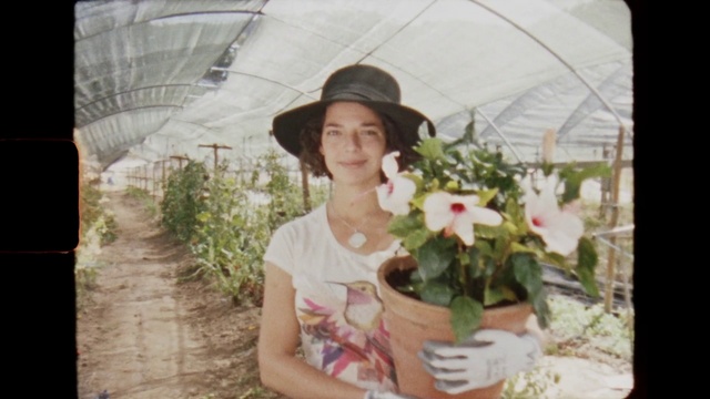Video Reference N1: Plant, Flowerpot, Flower, Smile, Hat, Sun hat, Houseplant, Grass, Happy, Petal