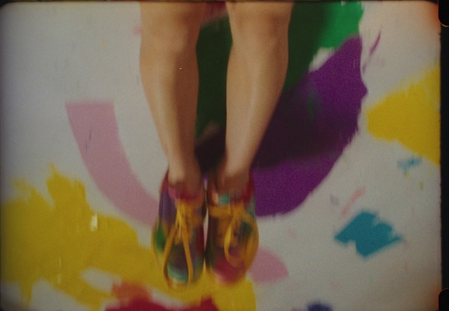 Video Reference N8: Shoe, Hand, Leg, Paint, Knee, Thigh, Gesture, Yellow, Art, Nail
