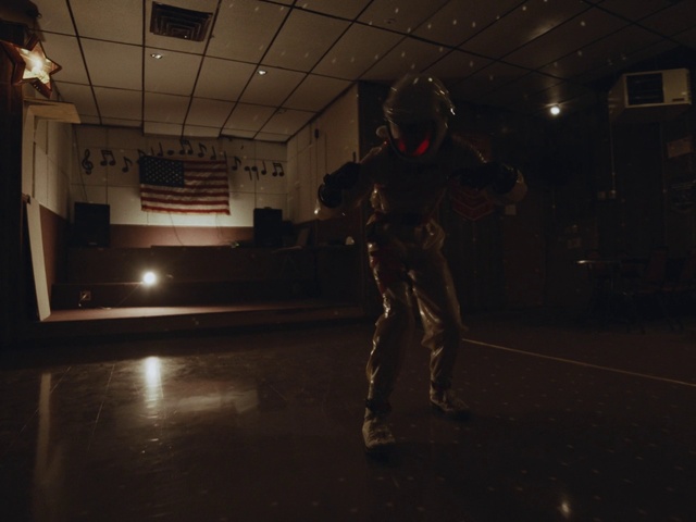 Video Reference N1: Flash photography, Floor, Flooring, Helmet, Military person, Entertainment, Darkness, Event, Art, Boot