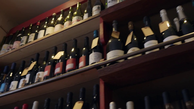 Video Reference N16: Bottle, Furniture, Shelf, Glass bottle, Wine cellar, Winery, Shelving, Alcoholic beverage, Drink, Wine bottle