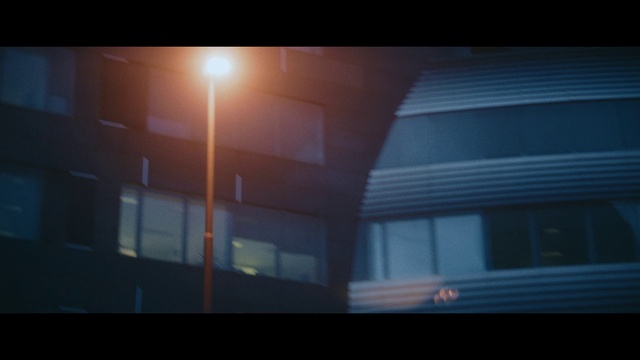 Video Reference N2: Building, Rectangle, Tints and shades, Street light, Window, Font, Facade, Lens flare, Darkness, City