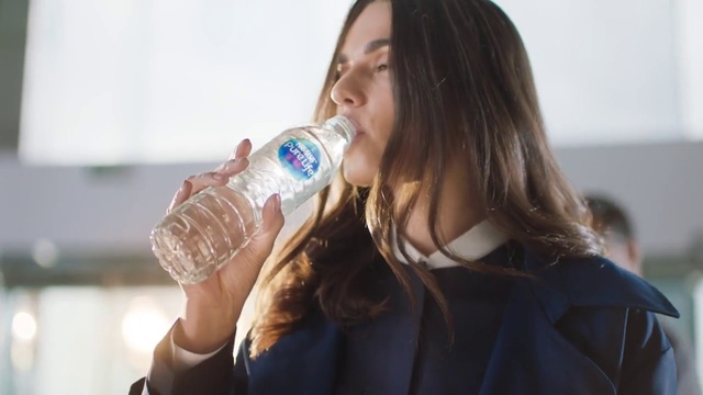 Video Reference N2: Hair, Water, Bottled water, Drinkware, Bottle, Facial expression, Mineral water, Drinking water, Mouth, Water bottle