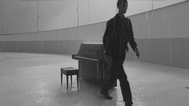 Video Reference N1: Standing, Black-and-white, Grey, Style, Floor, Flooring, Pianist, Monochrome photography, Monochrome, Darkness
