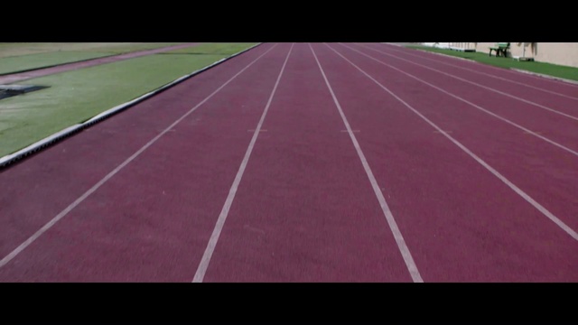 Video Reference N0: Road surface, Asphalt, Rectangle, Track and field athletics, Magenta, Athlete, Sports, Parallel, Flooring, Grass