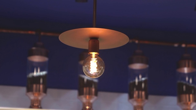 Video Reference N2: Light, Amber, Lamp, Facial hair, Gas, Tints and shades, Electricity, Light bulb, Ceiling fixture, Glass