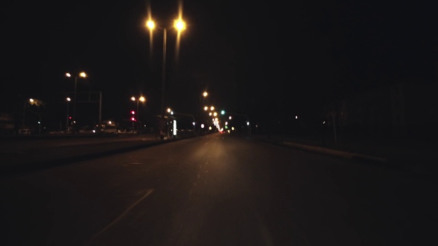 Video Reference N3: Automotive lighting, Street light, Road surface, Asphalt, Electricity, Thoroughfare, Road, Tints and shades, Midnight, City