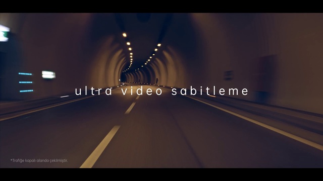 Video Reference N1: Automotive lighting, Asphalt, Road surface, Font, Thoroughfare, Horizon, Tints and shades, Symmetry, Road, Auto part