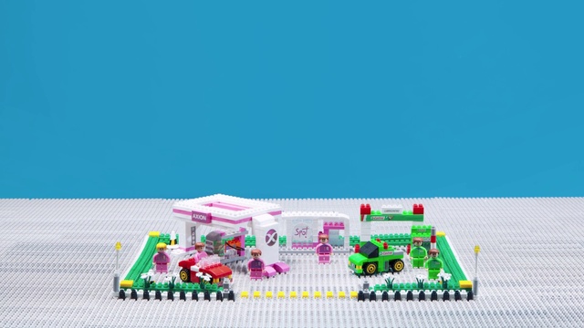 Video Reference N0: Rectangle, Toy block, Toy, Building sets, Lego, Font, Urban design, Construction set toy, Grass, Games