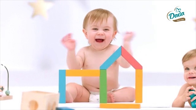 Video Reference N4: Cheek, Smile, Baby playing with toys, Baby & toddler clothing, Gesture, Happy, Baby grabbing for something, Sleeve, Baby, Toddler