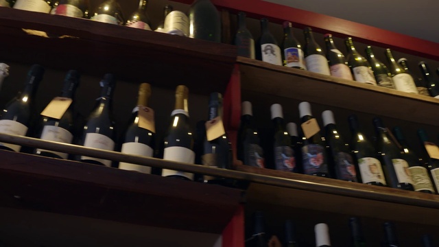 Video Reference N10: Bottle, Furniture, Shelf, Shelving, Winery, Wine cellar, Glass bottle, Alcoholic beverage, Drinkware, Drink