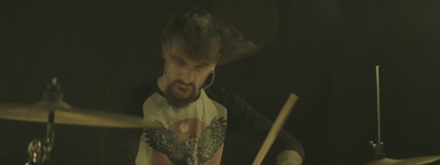 Video Reference N6: Flash photography, T-shirt, Musical instrument accessory, Music, Beard, Elbow, Axe, Entertainment, Event, Drum stick
