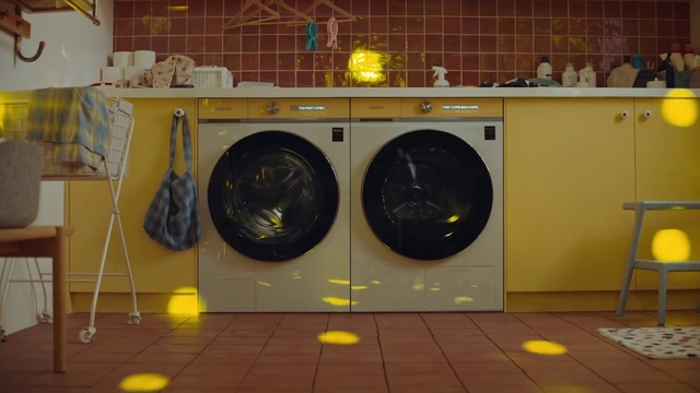 Video Reference N1: Laundry room, Clothes dryer, Washing machine, Laundry, Yellow, Automotive tire, Floor, Home appliance, Flooring, Major appliance