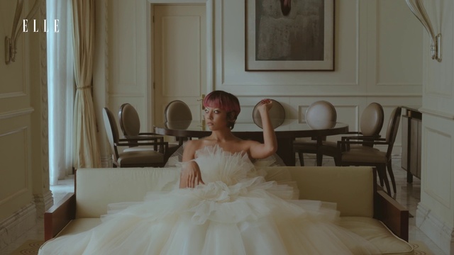 Video Reference N6: Wedding dress, Shoulder, Furniture, Comfort, Dress, Bridal clothing, Picture frame, Bridal party dress, Neck, Sleeve