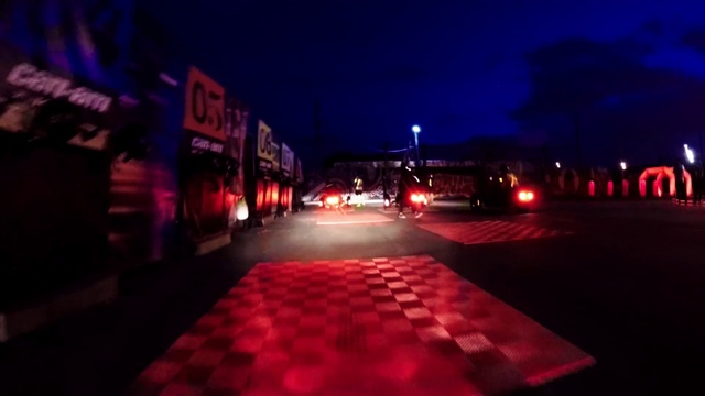 Video Reference N1: Automotive lighting, Sky, Building, Road surface, Electricity, Street light, Landmark, Flooring, Vehicle, Tints and shades
