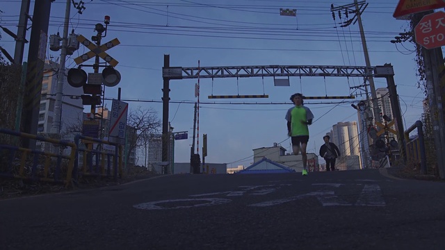 Video Reference N1: Sky, Electricity, Overhead power line, Road surface, Asphalt, Rolling, Electrical supply, Gas, Road, Track