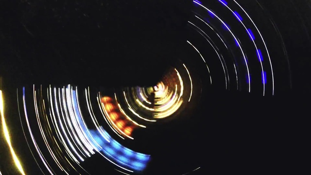 Video Reference N6: Gas, Circle, Electric blue, Electricity, Event, Darkness, Space, Entertainment, Art, Spiral