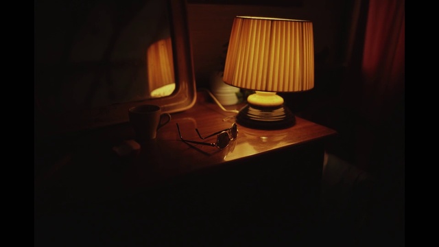 Video Reference N3: Table, Lamp, Wood, Tints and shades, Darkness, Lantern, Lampshade, Hardwood, Light fixture, Gas