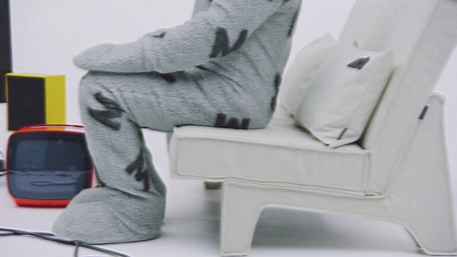 Video Reference N4: Shoe, Furniture, Comfort, Sleeve, Grey, Chair, Flooring, Electronic device, Human leg, Automotive design
