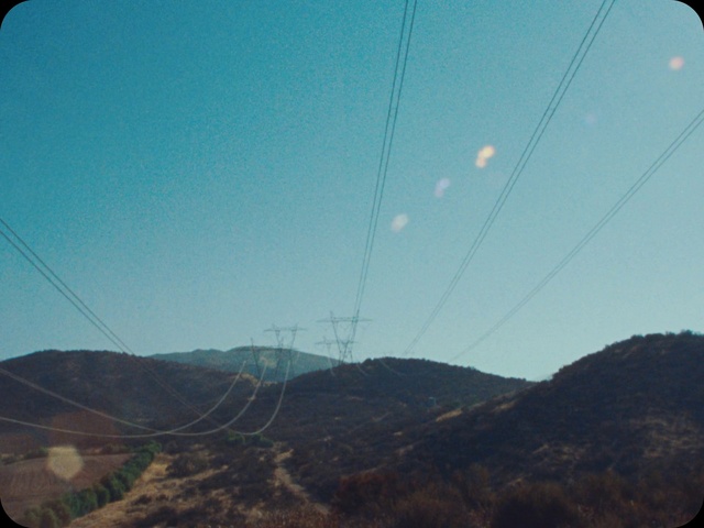 Video Reference N3: Sky, Daytime, Mountain, Electricity, Overhead power line, Cloud, Slope, Natural landscape, Line, Window