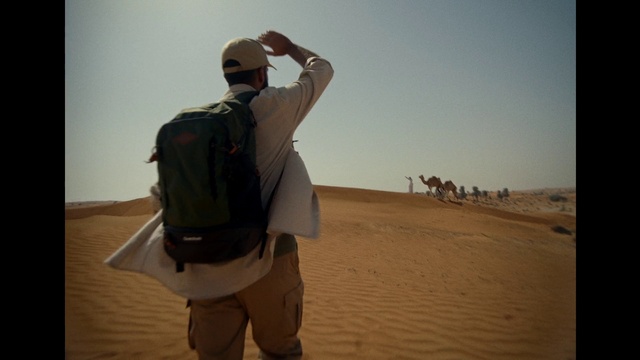 Video Reference N6: Sky, Shorts, Gesture, Travel, Erg, Landscape, Singing sand, Luggage and bags, Fun, Hat