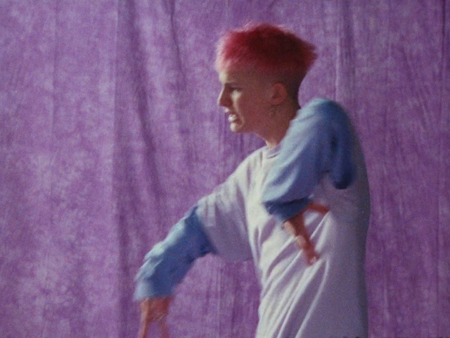 Video Reference N9: Purple, Sleeve, Gesture, Happy, Flash photography, Magenta, T-shirt, Entertainment, Electric blue, Fun