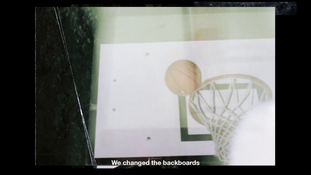 Video Reference N3: Basketball hoop, Rectangle, Font, Circle, Wood, Sports equipment, Net, Visual arts, Ball, Room
