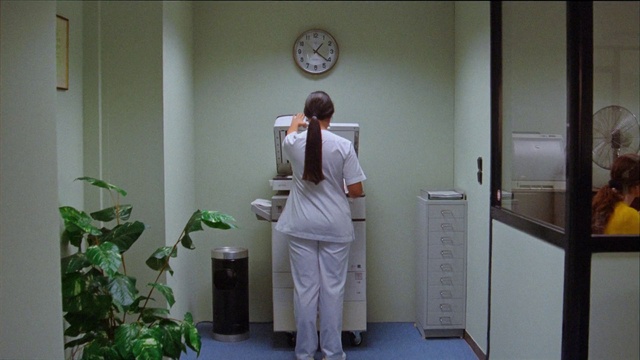Video Reference N2: Plant, Sleeve, Standing, White coat, Health care provider, Building, Clock, Health care, Door, Clinic