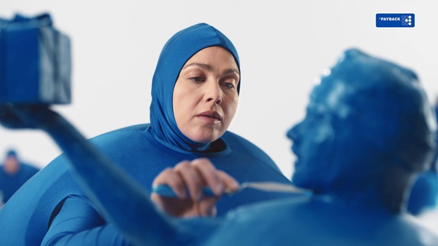 Video Reference N0: Blue, Mouth, Azure, Sleeve, Gesture, Headgear, Happy, Electric blue, Landscape, Comfort